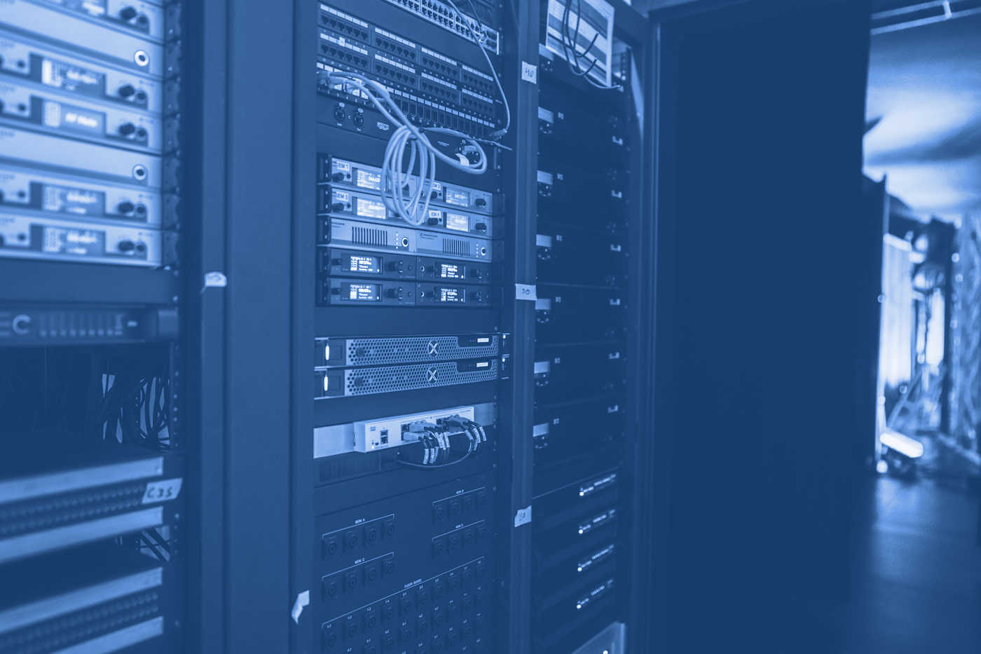 Editorial photograph of server racks illustrating digital infrastructure